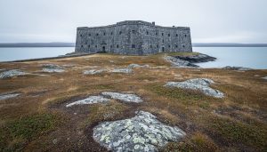 Prince of Wales Fort in Churchill, Manitoba, with thick stone walls on the tundra shoreline at the mouth of the Churchill River meeting Hudson Bay.